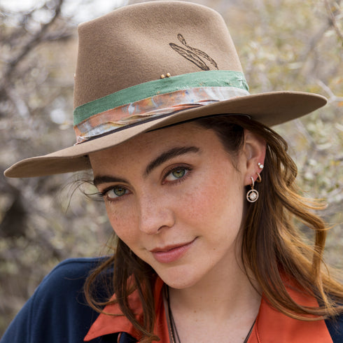 with her brim flipped down, as an alternate hat, earring vibe for both<br>shop the look > earth day and<br>shop the look > chillaxing <span class='visuallyhidden'>Text, phone 323-404-2959 for shopping assistance.</span>